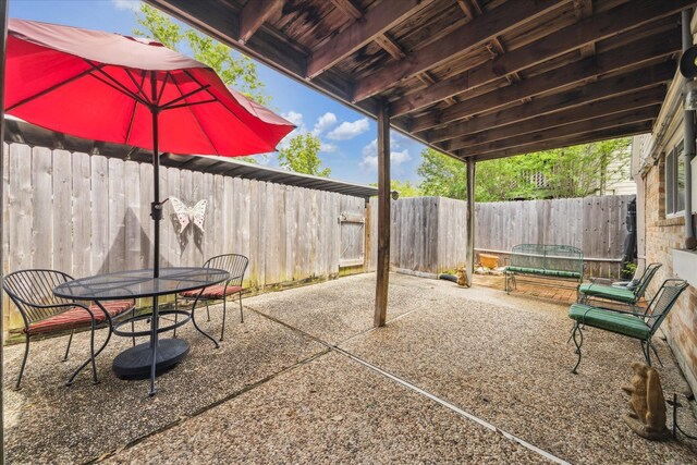 view of patio / terrace featuring a fenced backyard and outdoor dining space