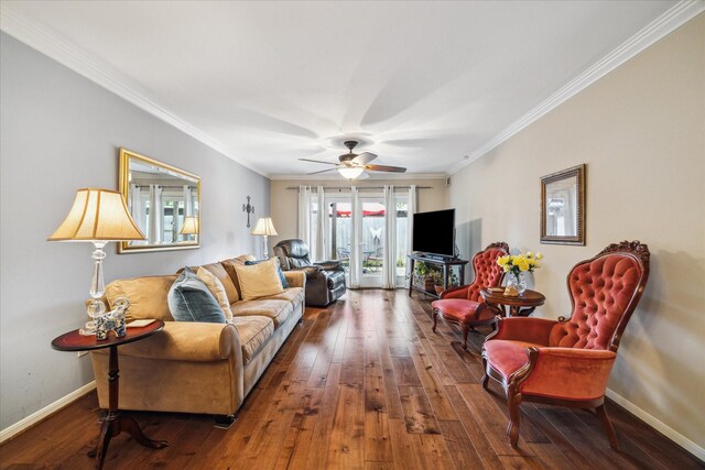 living area featuring crown molding, a ceiling fan, baseboards, and hardwood / wood-style flooring