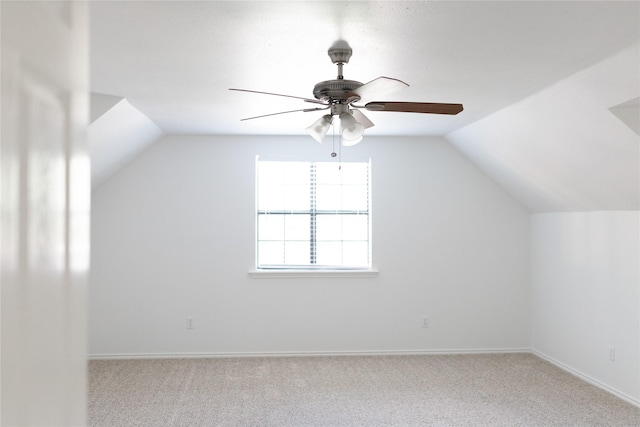 bonus room with ceiling fan, lofted ceiling, carpet, and baseboards