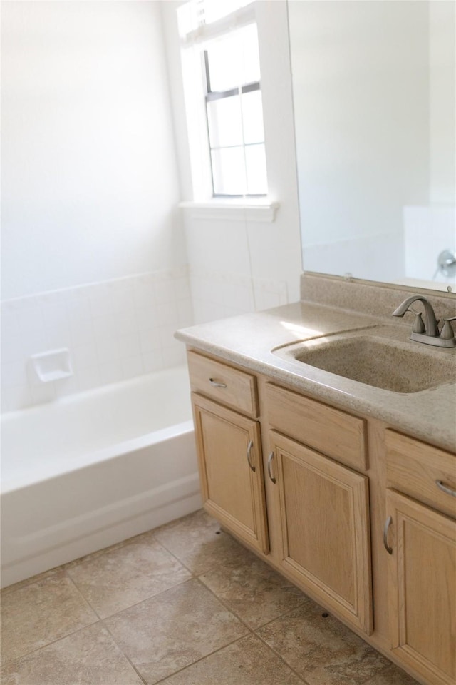 bathroom featuring a bathing tub and vanity