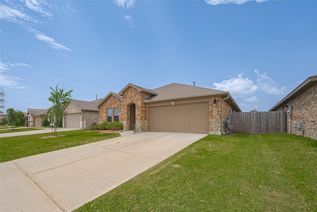 3923 Hawaiian Ct, Baytown, TX 77521 - view of front facade featuring a garage, driveway, and stone siding