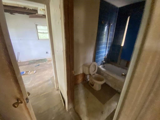 bathroom with shower / bathtub combination and toilet