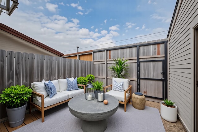 view of patio with fence and an outdoor hangout area