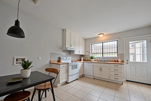 kitchen with a sink, white appliances, white cabinetry, decorative backsplash, and under cabinet range hood