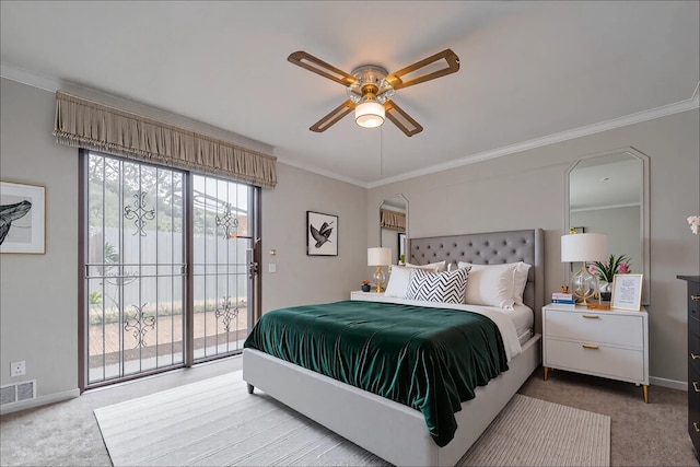 carpeted bedroom with access to outside, baseboards, visible vents, and ornamental molding