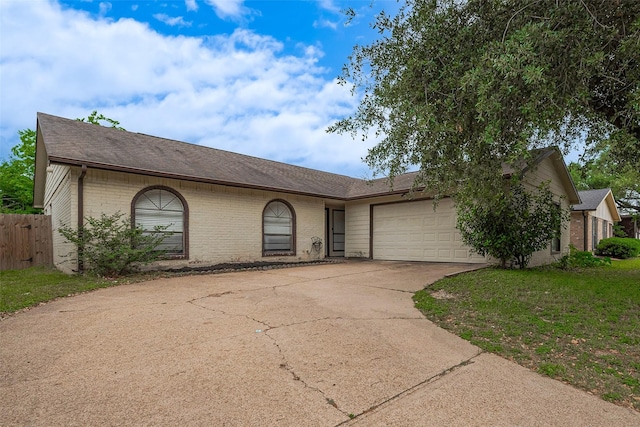 single story home with roof with shingles, brick siding, fence, concrete driveway, and an attached garage
