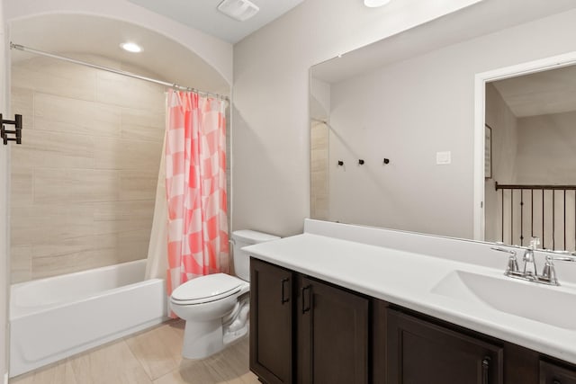 bathroom with vanity, toilet, shower / bath combination with curtain, recessed lighting, and visible vents