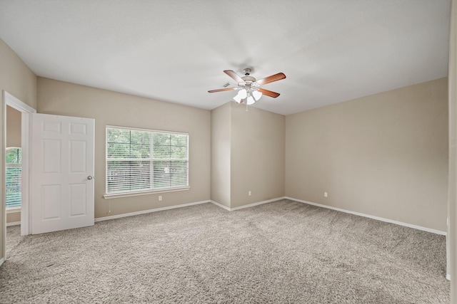 unfurnished room with carpet floors, ceiling fan, and baseboards
