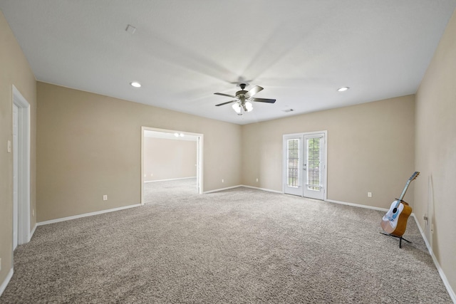 carpeted spare room featuring recessed lighting, ceiling fan, and baseboards