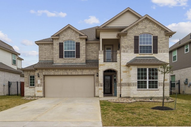 view of front of home with fence, a front lawn, and a garage
