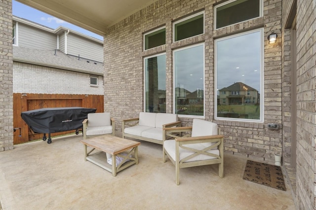 view of patio featuring fence and outdoor lounge area