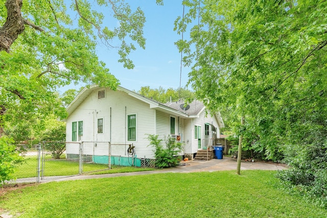 202 10th Ave N, Texas City, TX 77590 - back of property featuring a lawn, fence, a gate, and crawl space