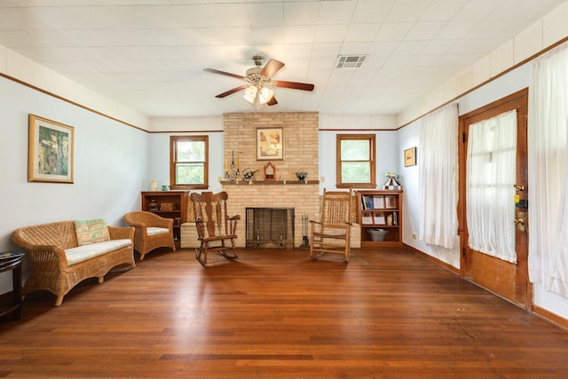202 10th Ave N, Texas City, TX 77590 - living area featuring a healthy amount of sunlight, a ceiling fan, hardwood / wood-style flooring, and visible vents