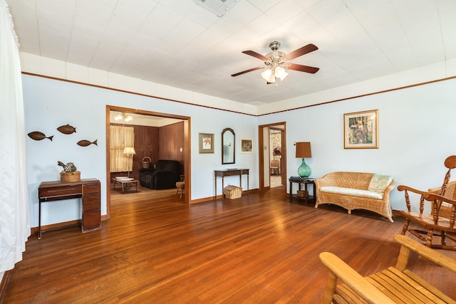 202 10th Ave N, Texas City, TX 77590 - living area with visible vents, a ceiling fan, baseboards, and wood finished floors