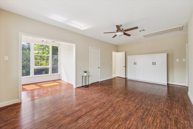 7924 Woodway Dr, Houston, TX 77063 - unfurnished bedroom featuring baseboards, ceiling fan, attic access, and wood finished floors