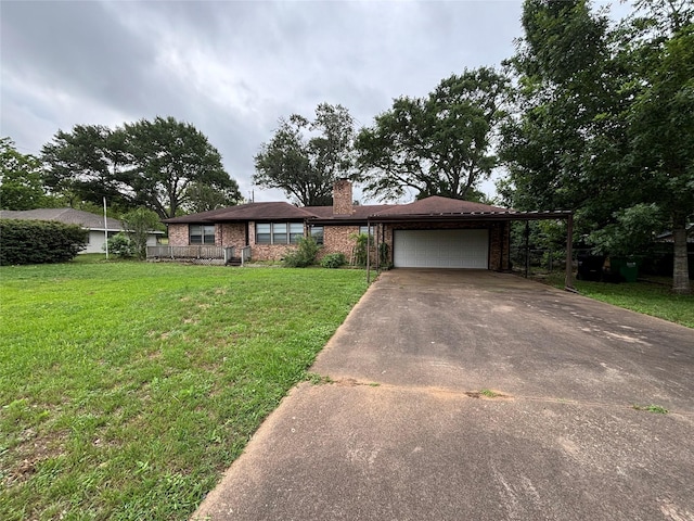 single story home with an attached garage, brick siding, a front yard, a chimney, and concrete driveway