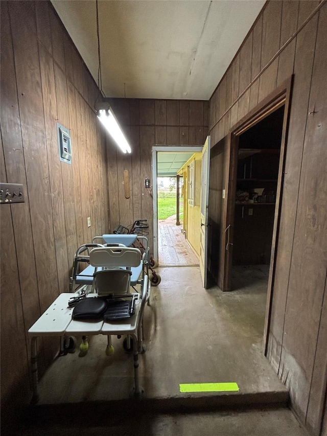 garage featuring wood walls