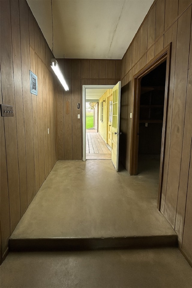 1904 Gun And Rod Rd, Brenham, TX 77833 - hallway featuring wood walls and concrete floors