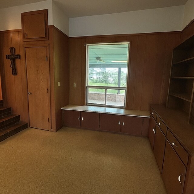 1904 Gun And Rod Rd, Brenham, TX 77833 - unfurnished office with wooden walls and light carpet