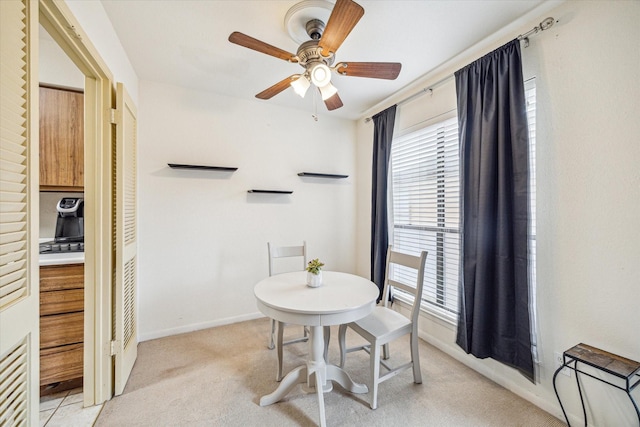 16111 Aspenglenn Dr Unit 404, Houston, TX 77084 - dining area with ceiling fan, light carpet, and baseboards