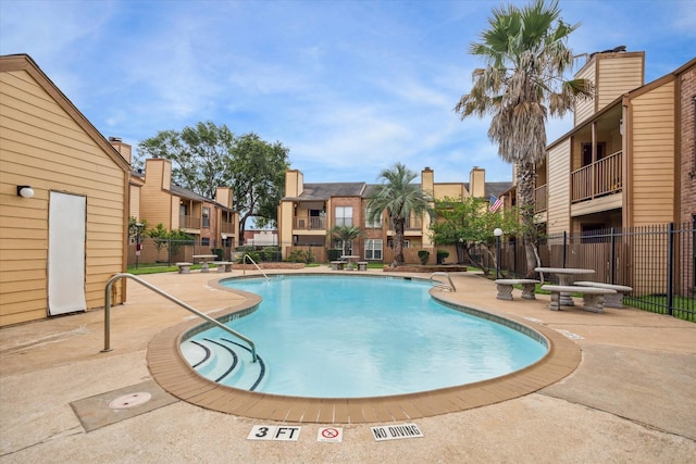 16111 Aspenglenn Dr Unit 404, Houston, TX 77084 - pool featuring a patio area, fence, and a residential view