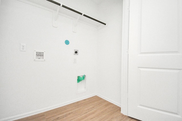 clothes washing area featuring washer hookup, laundry area, light wood-style flooring, baseboards, and hookup for an electric dryer