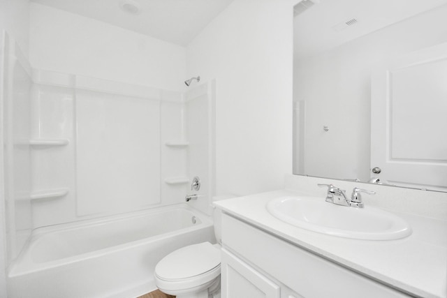 bathroom featuring vanity, bathtub / shower combination, toilet, and visible vents