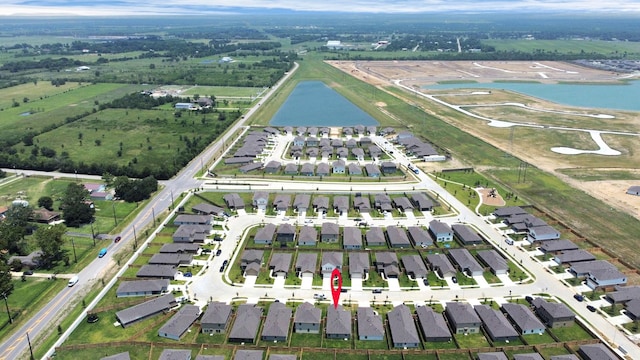 bird's eye view with a water view and a residential view