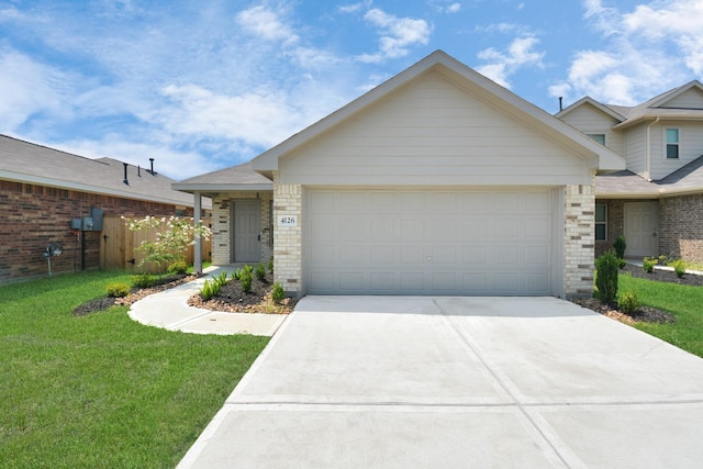 view of front of home featuring brick siding, a garage, and driveway