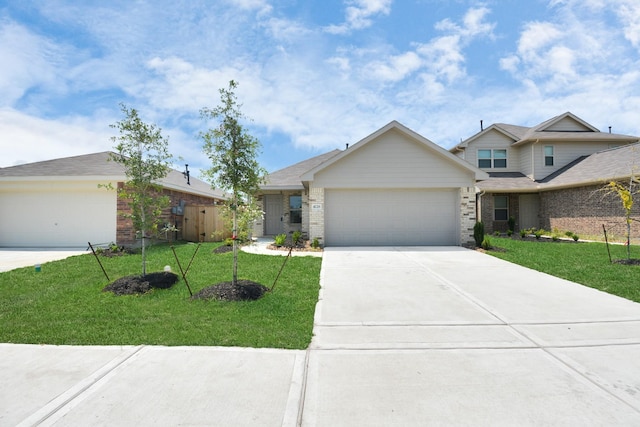 view of front of property with brick siding, an attached garage, driveway, and a front lawn