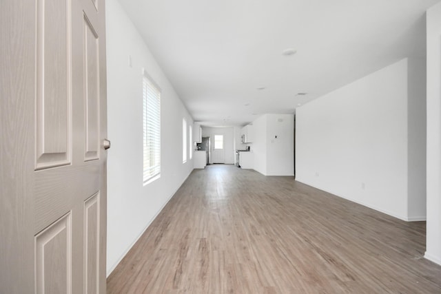 unfurnished living room featuring light wood-type flooring