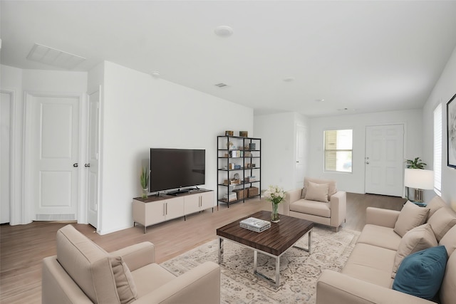 living room featuring wood finished floors and visible vents