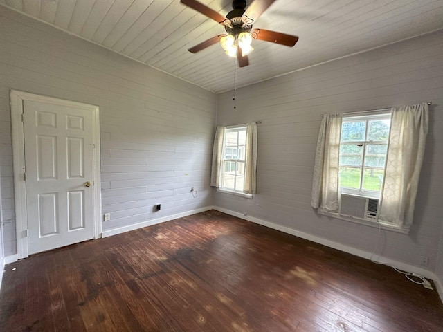 empty room with wood-type flooring, ceiling fan, and a healthy amount of sunlight