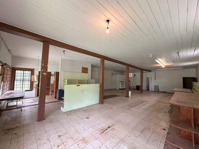interior space featuring tile patterned floors and wooden ceiling