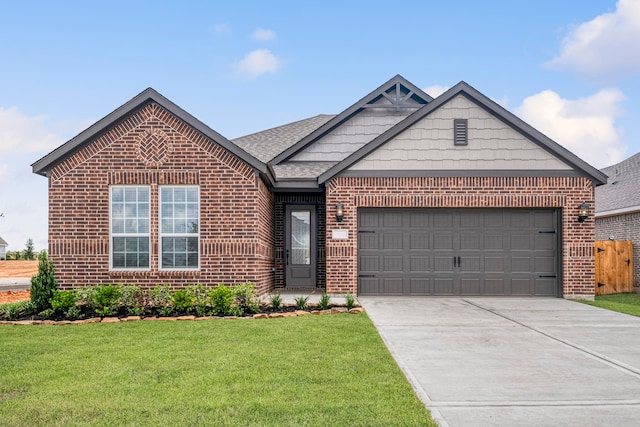 craftsman inspired home with a garage, concrete driveway, a front lawn, and brick siding