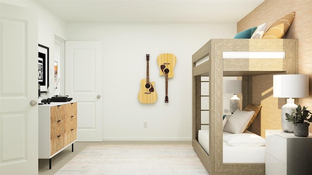 bedroom featuring baseboards
