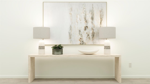 interior details featuring baseboards and wood finished floors