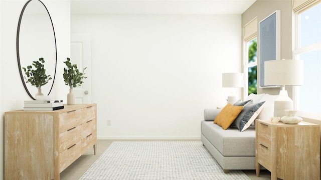 living area featuring baseboards