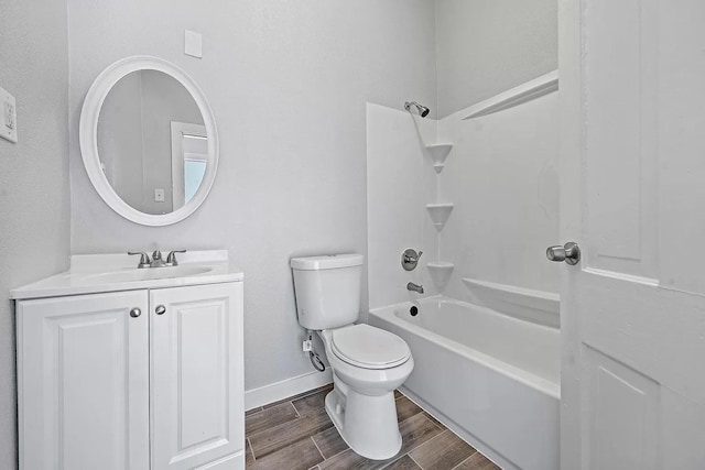805 10th St, Galveston, TX 77550 - bathroom featuring shower / bath combination, wood finished floors, vanity, baseboards, and toilet