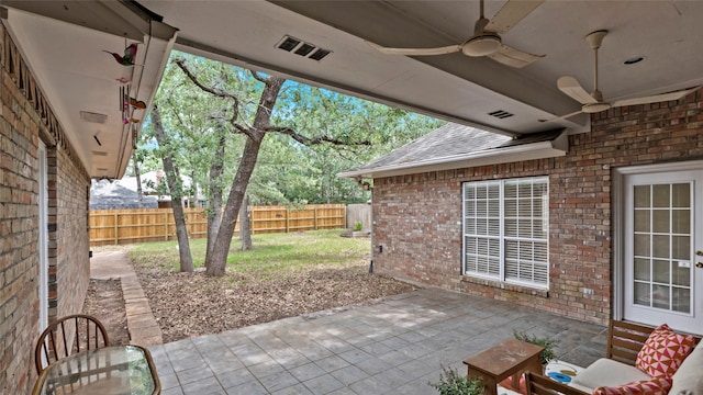 view of patio featuring a fenced backyard and a ceiling fan