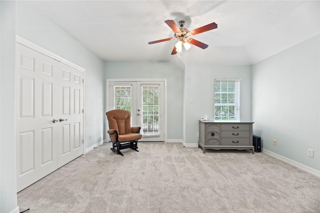 sitting room with french doors, a ceiling fan, carpet, and baseboards