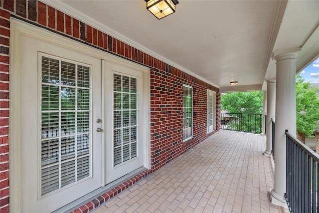 view of patio with covered porch and french doors