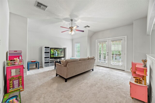 living area with ceiling fan, carpet, french doors, and visible vents