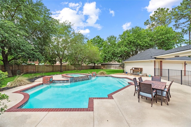 view of swimming pool featuring a fenced backyard, a patio, outdoor dining area, and a pool with connected hot tub