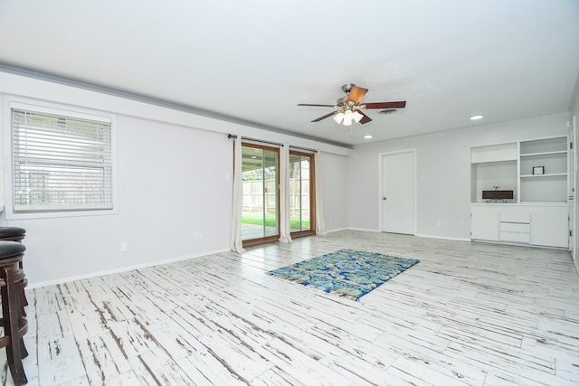 unfurnished living room with baseboards, light wood finished floors, a ceiling fan, and recessed lighting