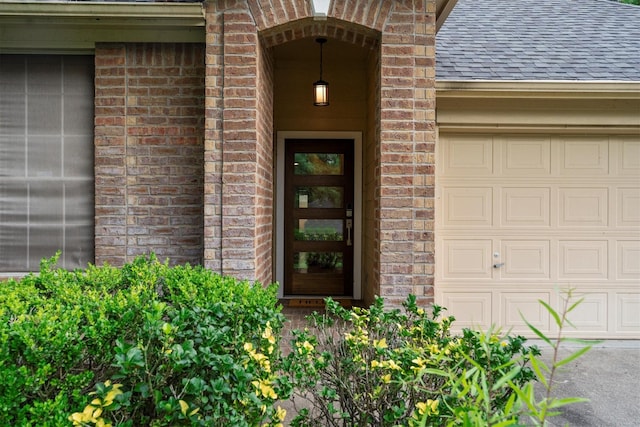 1635 Ashton Village Dr, Spring, TX 77386 - doorway to property with brick siding and a shingled roof