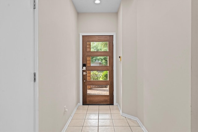 1635 Ashton Village Dr, Spring, TX 77386 - doorway to outside with baseboards and light tile patterned flooring