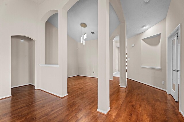 1635 Ashton Village Dr, Spring, TX 77386 - interior space featuring arched walkways, baseboards, and wood finished floors