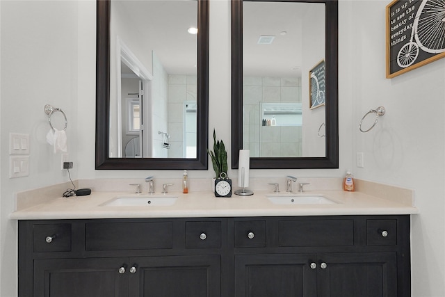 6113 Nicholas Grove Pl, Houston, TX 77055 - bathroom featuring double vanity, a sink, and a tile shower