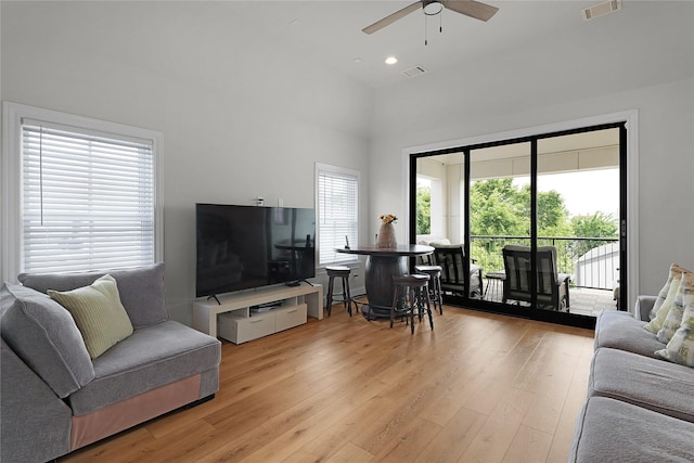 6113 Nicholas Grove Pl, Houston, TX 77055 - living room with ceiling fan, light wood-style flooring, visible vents, and a wealth of natural light